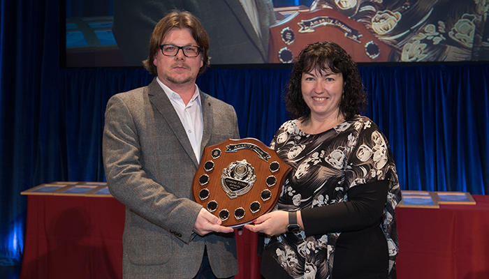 Amenity Sprayer Operator of the Year winner Nathan Hume. Presented with the shield at the BTME 2018 welcome celebration by Dr. Ruth Mann of STRI.